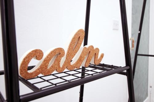 a sign for a cafe on a shelf at Garden | Parking | 4BR in Newport
