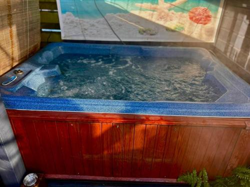 a jacuzziificialificialificialificialificialificialificialificialificialificialificial at Cozy Ibiza style beach house with jacuzzi & private garden near Amsterdam in Vijfhuizen