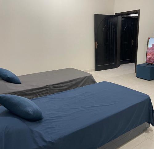 Un pat sau paturi într-o cameră la ستوديو غرفة بحمام