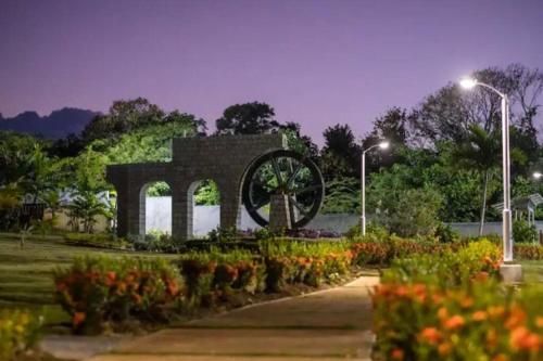 a monument in a park with flowers and lights at The Gardenia Compound - Ocho Rios Area in Richmond