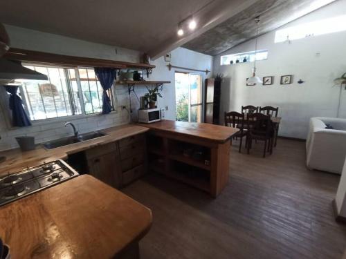 a kitchen with a sink and a counter top at La Floresta in La Floresta