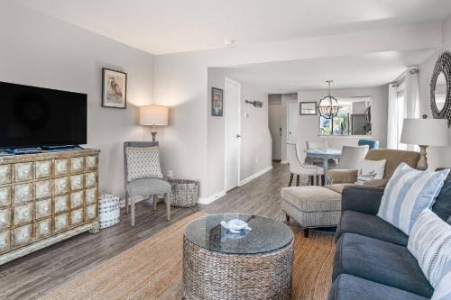 a living room with a couch and a table at Harbor Island F206 in Oceanmarsh Subdivision