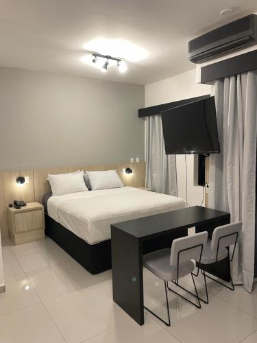 Cama ou camas em um quarto em Flat no hotel Q. Paulista nos Jardins, com sacada!