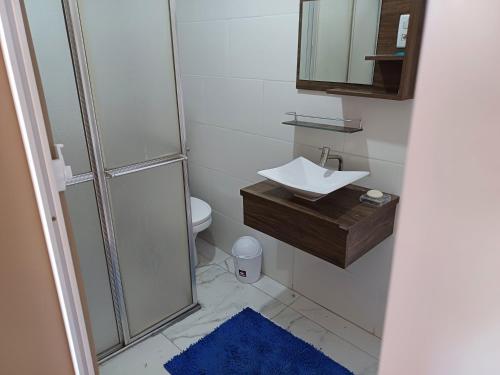 a bathroom with a shower and a sink and a toilet at #PARADISE SUITES - TATUAPÉ in Sao Paulo