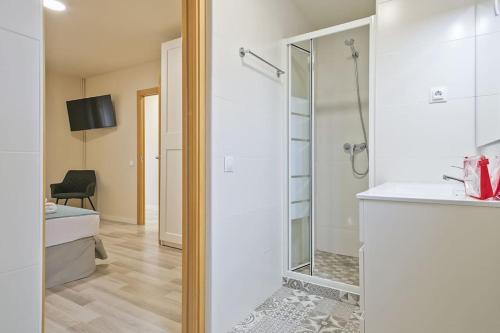 a bathroom with a shower and a sink at Alcam Baro SA in Barcelona