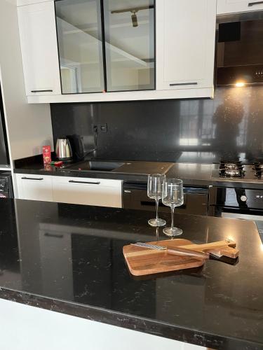 a kitchen with two wine glasses on a counter at ARC HOUSE in Istanbul