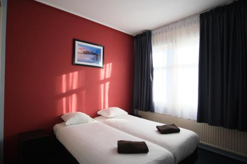 Кровать или кровати в номере Hotel Abba
