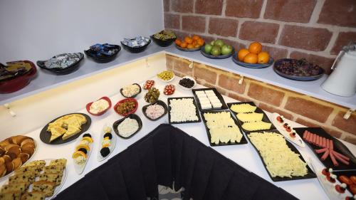 a table filled with different types of cheese and appetizers at Royal Tophane in Istanbul