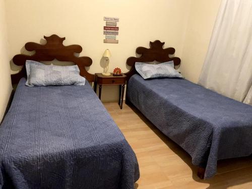 A bed or beds in a room at Recanto Alegre