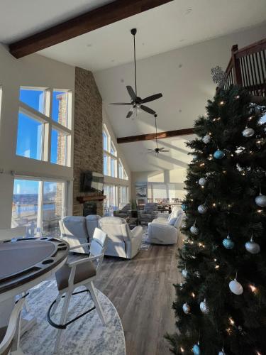 a christmas tree in the middle of a living room at Sunset Bluff at Table Rock Lake in Kimberling City