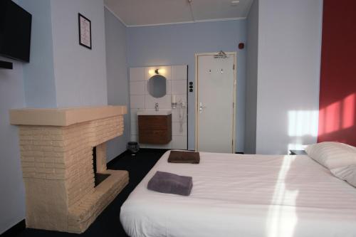 Кровать или кровати в номере Hotel Abba