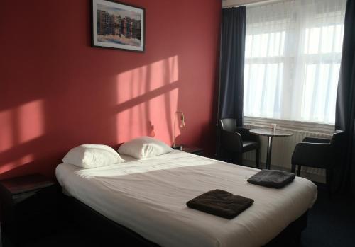 Кровать или кровати в номере Hotel Abba