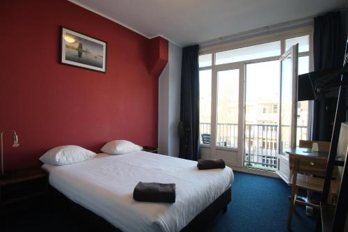 Кровать или кровати в номере Hotel Abba