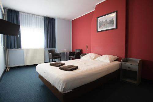 Кровать или кровати в номере Hotel Abba