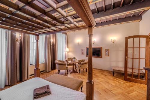 a hotel room with a bed and a table at Traditional Prague Apartment in Prague
