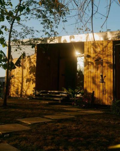 a small house with the sun shining on it at Casa Samambaia - sea view tropical paradise w' pool in Playa Venao