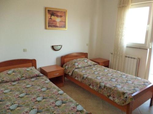 Ένα ή περισσότερα κρεβάτια σε δωμάτιο στο Ferienwohnung mit Balkon für vier Personen