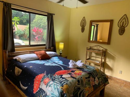 A bed or beds in a room at Toucan Valley Resort at Osa Mountain Village