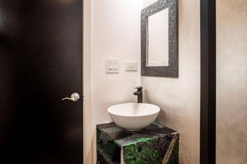 a bathroom with a sink and a mirror at Soul - Tiny Home Venao Cove in Playa Venao
