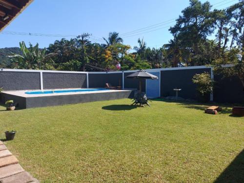 Taman di luar Hospedaria Morada das Orquídeas Boiçucanga