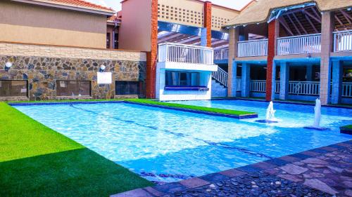 a swimming pool in front of a building at Jericho Hotel and Conferences in Thohoyandou