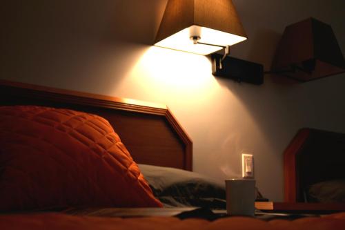 Postel nebo postele na pokoji v ubytování Hôtel Val-des-Sources