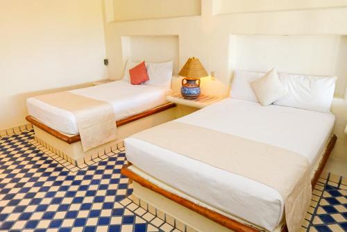 Postel nebo postele na pokoji v ubytování Villas San Sebastian