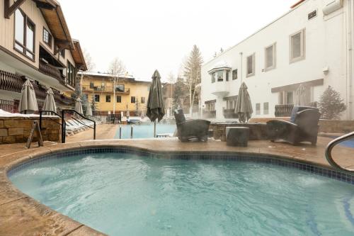 a swimming pool in the middle of a building at Lodge at Vail Condominiums in Vail