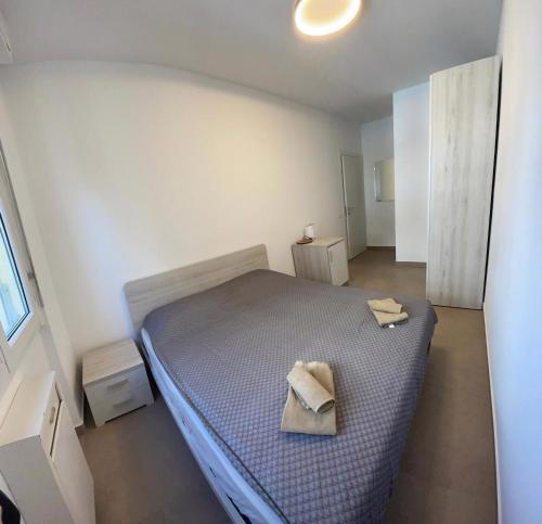 Łóżko lub łóżka w pokoju w obiekcie *Veranda's rooms* - Free parking in central Lugano