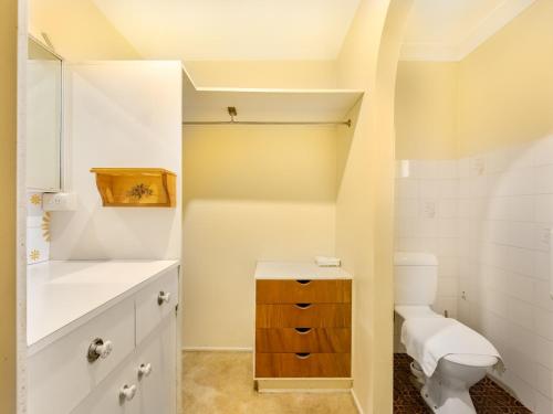 a bathroom with a toilet and a sink at Steps from Mall Super Convenient 3BR Cozy House in Brisbane
