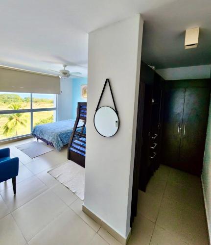 Una cama o camas en una habitación de PlayaBlanca Ocean Blue "Vista al Mar"