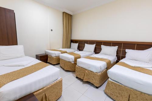 Cama ou camas em um quarto em فندق المسار أجياد - ALMASAR AJIAD HOTEL