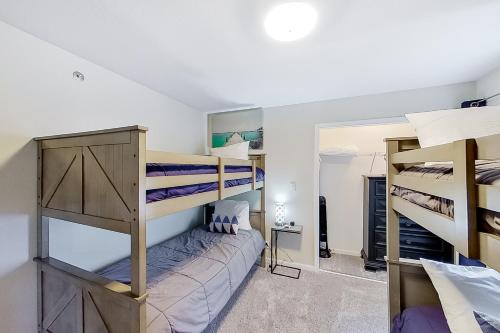a bedroom with three bunk beds in a room at Lake Ozark Vista in Lake Ozark