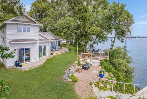 an aerial view of a house on the water at The Lakeside Lookout on Gingles Point in Arnolds Park
