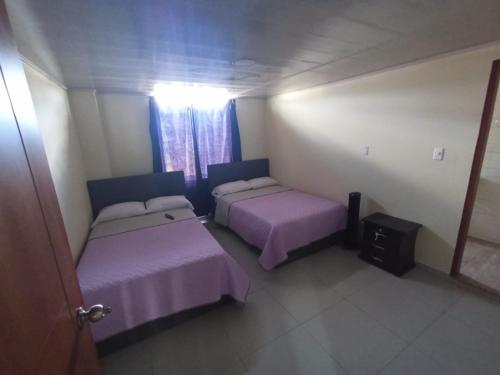 Un ou plusieurs lits dans un hébergement de l'établissement HOTEL EL GRAN CASINO ESMERALDA