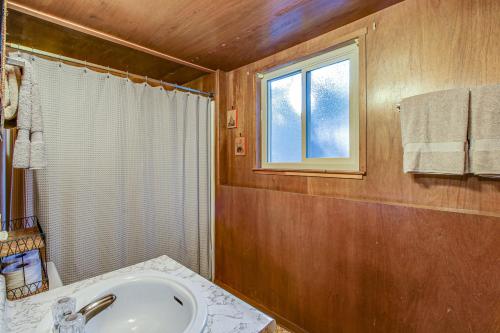 a bathroom with a sink and a window at Donner Lakefront Retreat in Truckee