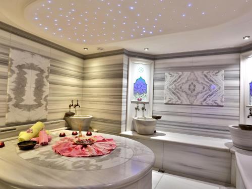a bathroom with two sinks and a table in it at AHC Old City Hotel in Istanbul