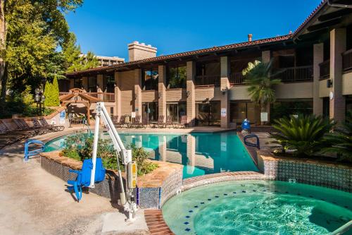 a swimming pool in front of a hotel at Arroyo Roble Resort at Oak Creek in Sedona