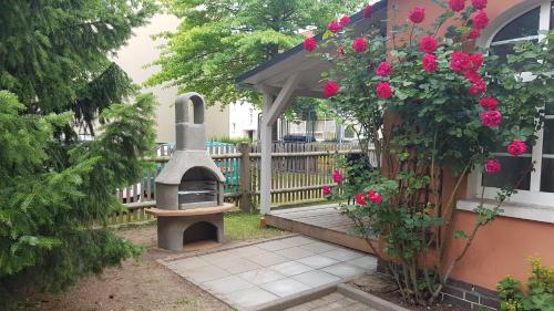 Taman di luar FEWO Geborgenheit ASZA mit strahlungsfreien Zonen