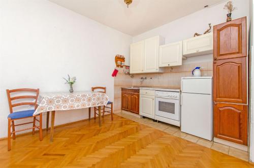 Kuchyň nebo kuchyňský kout v ubytování Apartments Bozjidar