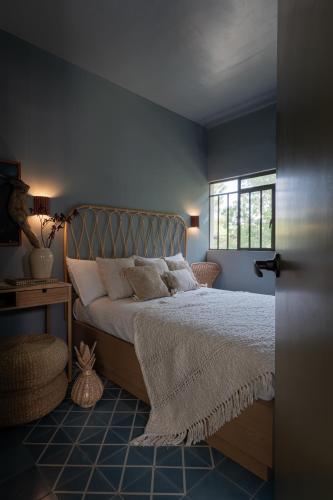 a bedroom with a bed and a window at Casa España in Guadalajara