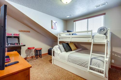 a bedroom with bunk beds and a desk at Eden Condo with Community Hot Tub, Close to Skiing in Eden
