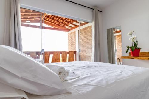 Tempat tidur dalam kamar di Rancho da Cachaça Pousada