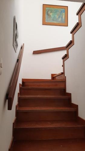 a set of stairs with a painting on the wall at CASA DE PLAYA Durante todo el año in Punta Negra