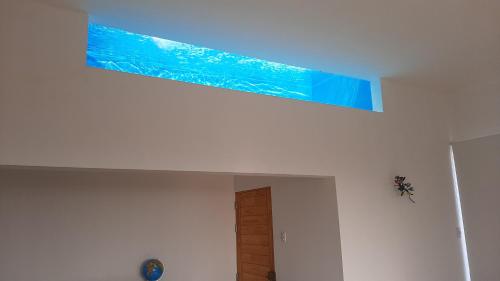 a blue painting on the ceiling of a room at CASA DE PLAYA Durante todo el año in Punta Negra