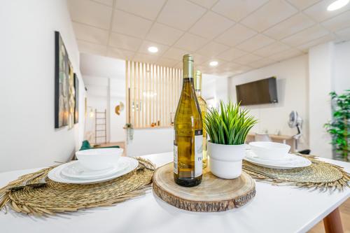a bottle of wine sitting on top of a table at Sintra Nest & Loft by Lisbon with Sintra in Sintra