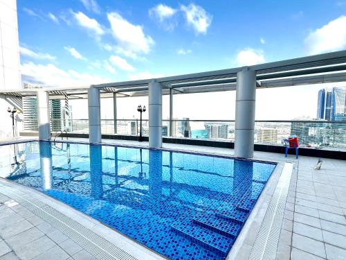 a swimming pool on the roof of a building at Brand new Modern Studio High Floor near Burj in Dubai