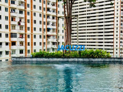 a large body of water in front of a building at New 2BR or 3BR Homey Getaway stay 7 to 10 pax at Urban Suites, Georgetown by URBAN STAYCATION LOD in Jelutong