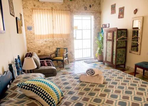 Postel nebo postele na pokoji v ubytování Casa Chaak Maya
