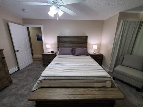 a bedroom with a large bed and a couch at Ocean & Mountain View Duplex, both sides in Juneau